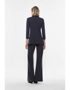 Pantalon de smoking flare finition satin – Imperial Femme
