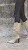 Bottes drapées en cuir nappa portées, en marche – Imperial Femme